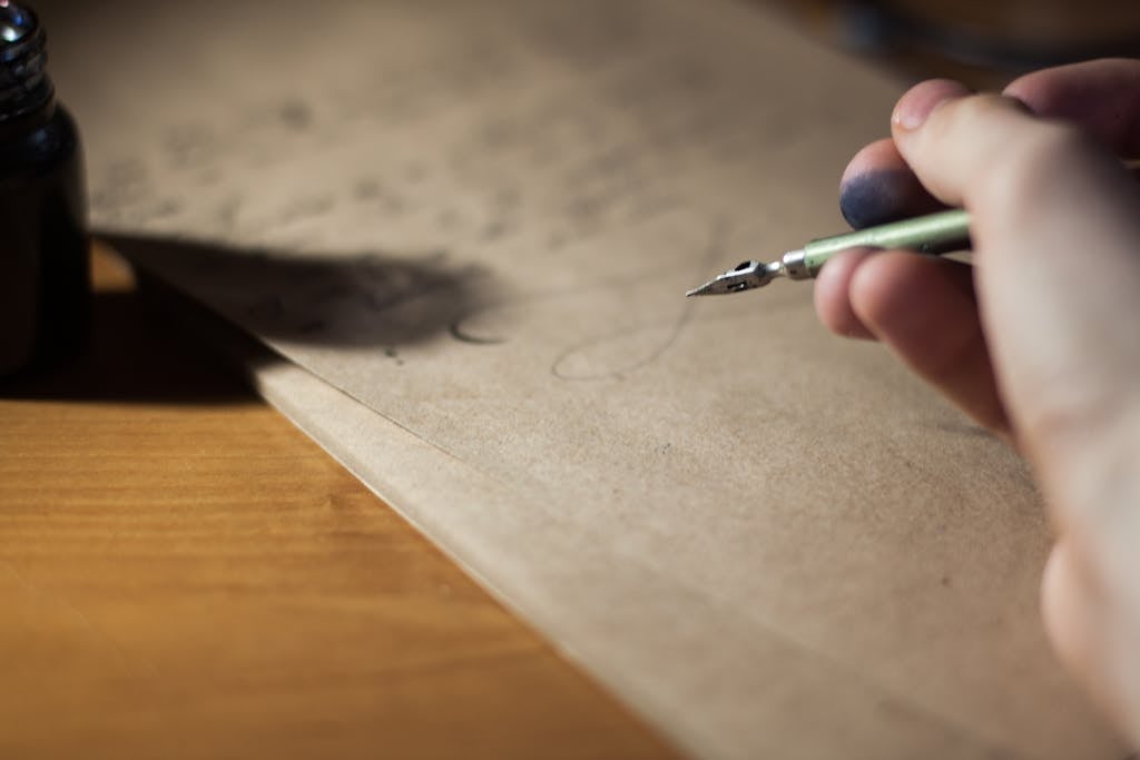 Person Holding Fountain Pen