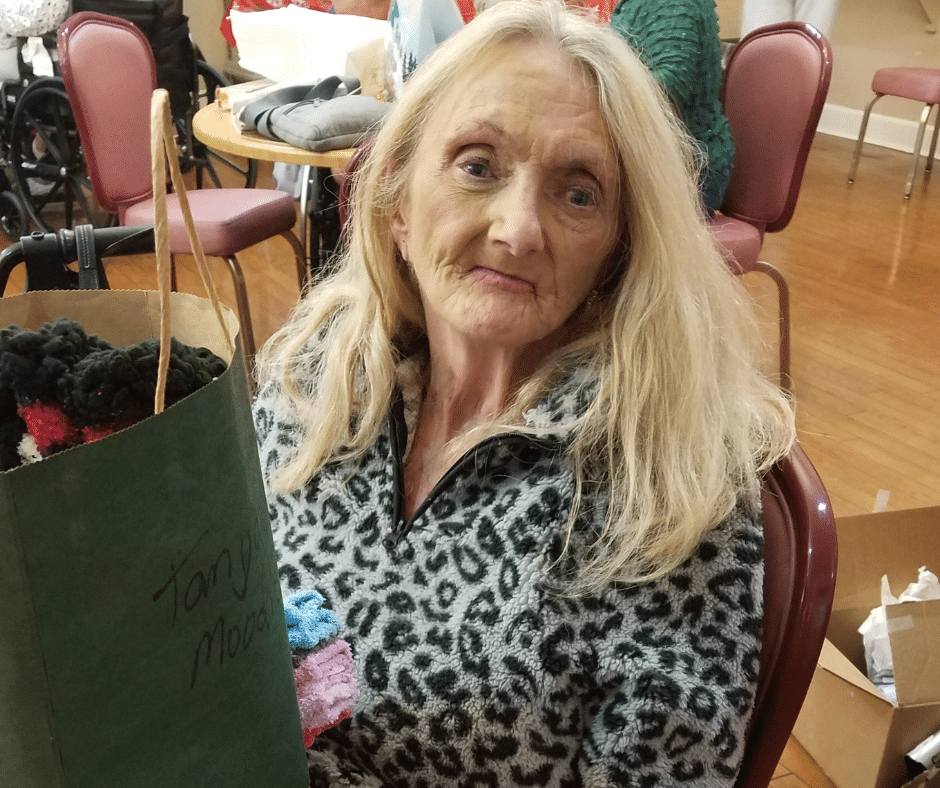 nursing home resident happy with gift